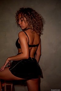 AriyaQ - AriyaQ reveals her tanned curves and sexy legs as she begins a sensual striptease
